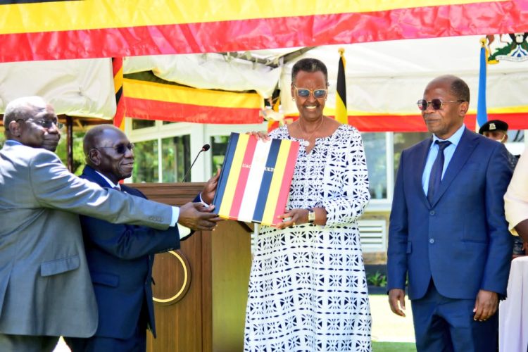 UNEB officials handing over the 2023 UACE results to Minister of Education and Sports Janet Museveni.