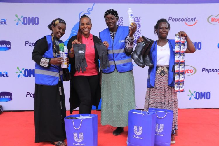 Wangechi Gitahi, Unilever Uganda’s CSP Manager, (second left) hands over an assortment of Unilever items to the women who are helping keep Kampala City clean. Unilever Uganda has highlighted the invaluable efforts of women who work tirelessly to keep Kampala city clean.