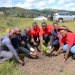 Absa bank staff and Bishop stuart Univeristy staff plant trees in commemoration of the World Earth Day.