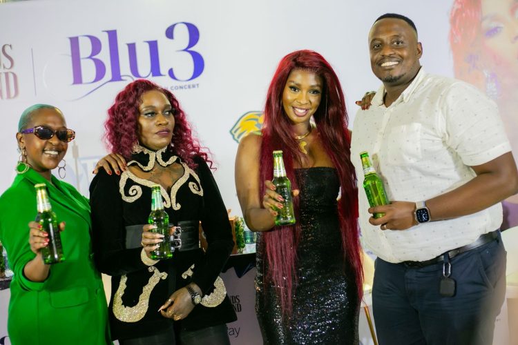 L-R: Blu 3 singers Lillian Mbabazi, Jackie Chandiru, and Cindy Sanyu posing with Roy Tumwizere, the Tusker Malt Brand Manager at UBL.