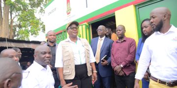 KCCA ED Dorothy Kisaka (in a cap) with UBL Managing Director Andrew Kilonzo (in a necktie) and other leaders after the launch of Bukoto Market Sanitation facility.