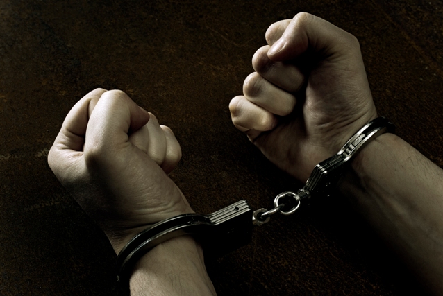 Male hands in handcuffs